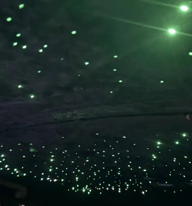 Green suede starlight headliner showing the shop's color options