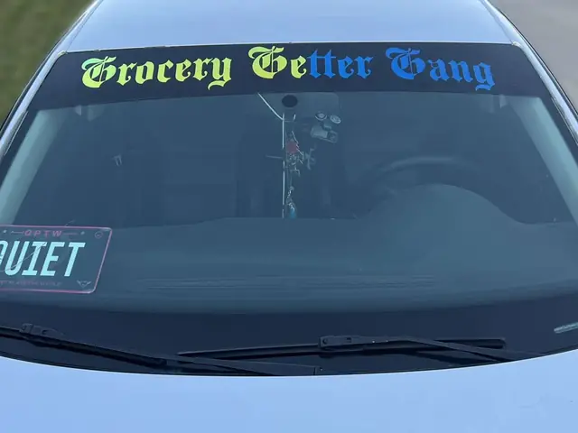 Custom vinyl windshield banner reading Grocery Getter Gang