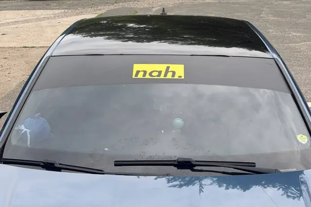 Rear window banner sticker reading nah