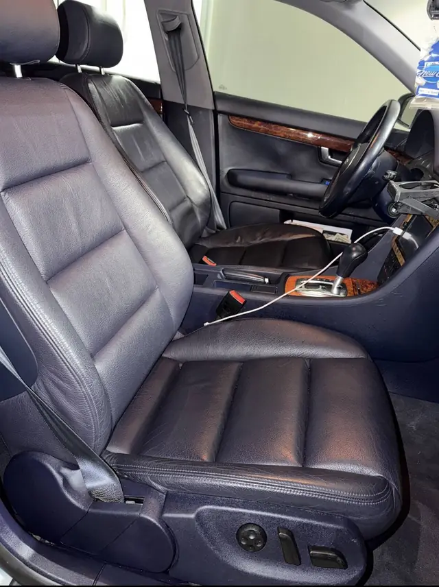 Cleaned front leather seats in a car detailed at Rook Auto Customs in West Springfield